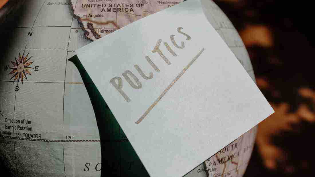 A globe with the word politics written on it