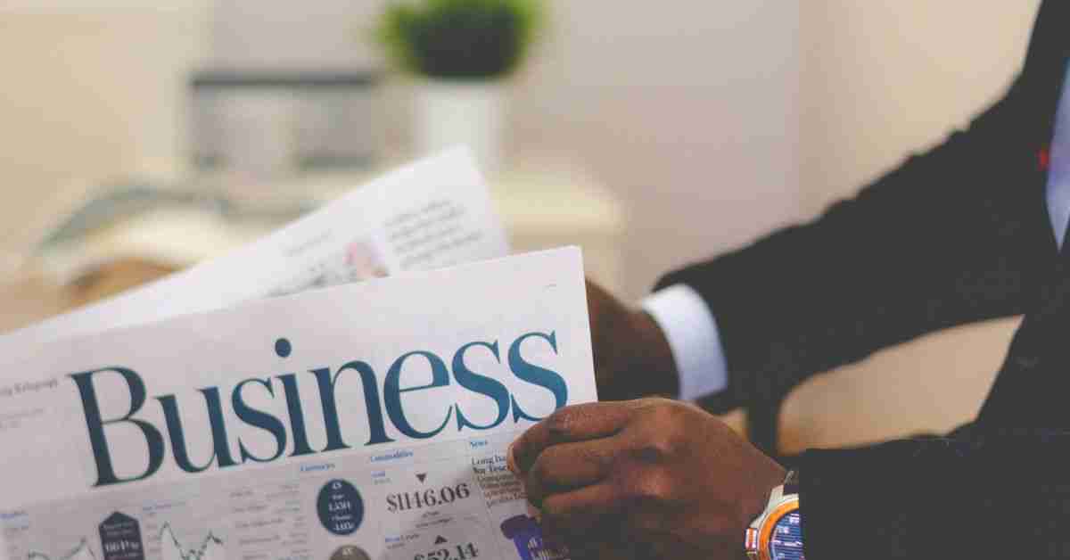 A man reading a business newspaper
